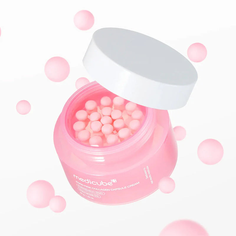 Medicube PDRN Pink Collagen Capsule Cream com esferas cor-de-rosa a flutuar em fundo branco