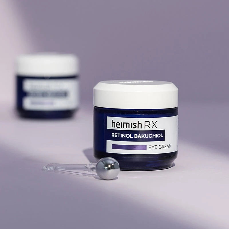 Heimish RX Retinol Bakuchiol Eye Cream com aplicador metálico de massagem, fundo lilás