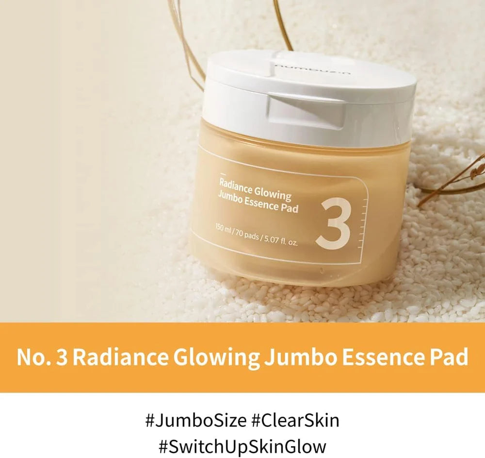 Frasco do numbuzin No.3 Radiance Glowing Jumbo Essence Pad sobre grãos de arroz