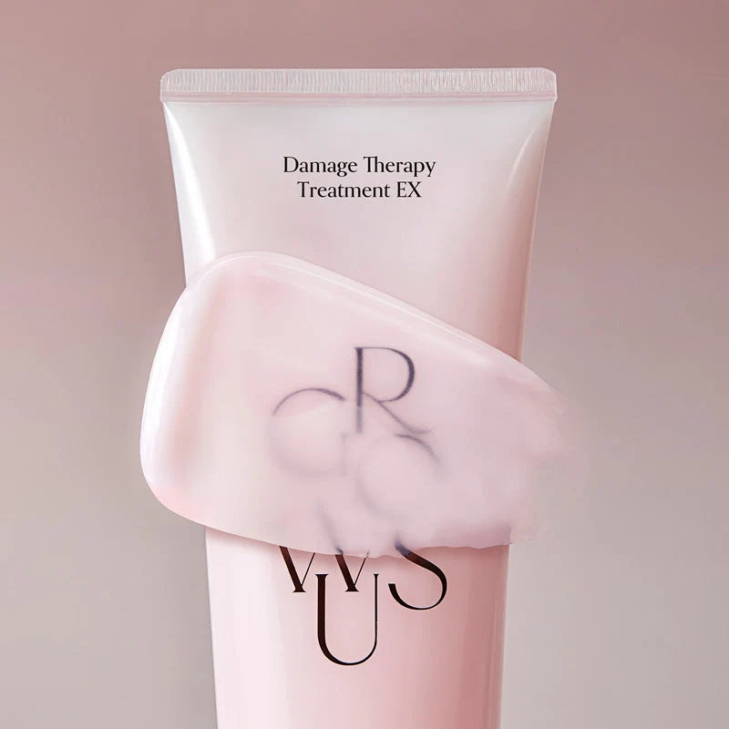 Textura do creme Growus espalhada sobre a embalagem do Damage Therapy Treatment EX