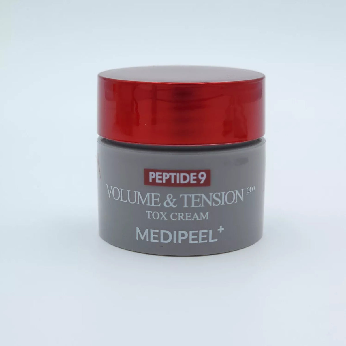 Pote do creme Volume & Tension Tox Cream Pro com tampa vermelha e corpo cinzento